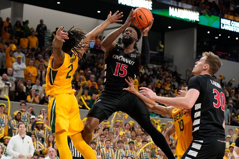 Jan 13, 2024; Waco, Texas, USA; Cincinnati Bearcats forward John Newman III (15) shoots over  Baylor Bears guard Jayden Nunn (2) during the first half at Paul and Alejandra Foster Pavilion. Mandatory Credit: Raymond Carlin III-USA TODAY Sports