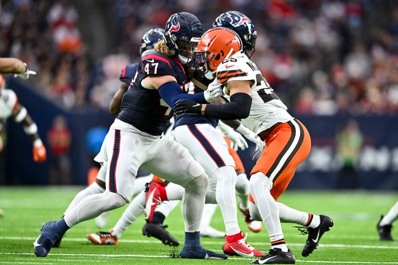 Houston Texans fullback Andrew Beck (47) and Cleveland Browns cornerback Cameron Mitchell (29) in action during an NFL football game, Sunday, Dec 24, 2023, in Houston. (AP Photo/Maria Lysaker)