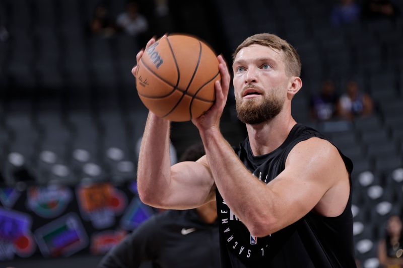 SACRAMENTO, CA - OCTOBER 9: Domantas Sabonis #11 of the Sacramento Kings warms up before the game against the Golden State Warriors during a NBA preseason game on October 9, 2024 at Golden 1 Center in Sacramento, California. NOTE TO USER: User expressly acknowledges and agrees that, by downloading and or using this Photograph, user is consenting to the terms and conditions of the Getty Images License Agreement. Mandatory Copyright Notice: Copyright 2024 NBAE (Photo by Rocky Widner/NBAE via Getty Images)