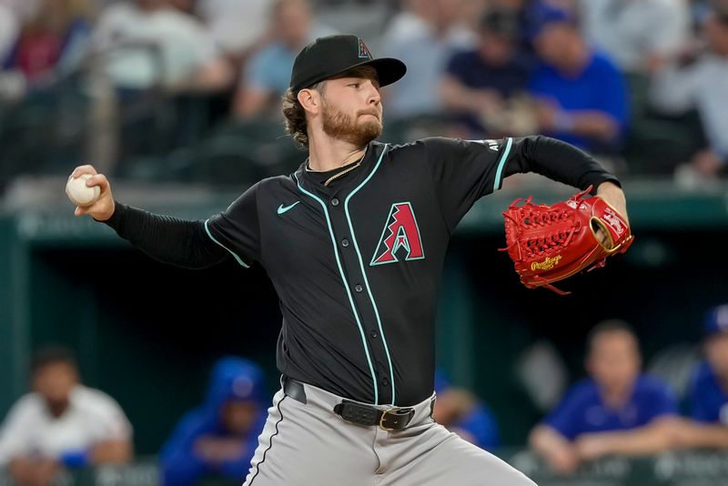 May 29, 2024; Arlington, Texas, USA; Arizona Diamondbacks starting pitcher Ryne Nelson (19) delivers a pitch to the Texas Rangers during the first inning at Globe Life Field. Mandatory Credit: Jim Cowsert-USA TODAY Sports