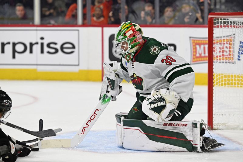 Oct 18, 2025; Philadelphia, Pennsylvania, USA; Minnesota Wild goaltender Jesper Wallstedt (30) makes a save against the Philadelphia Flyers during the first period at Wells Fargo Center. Mandatory Credit: Eric Hartline-Imagn Images