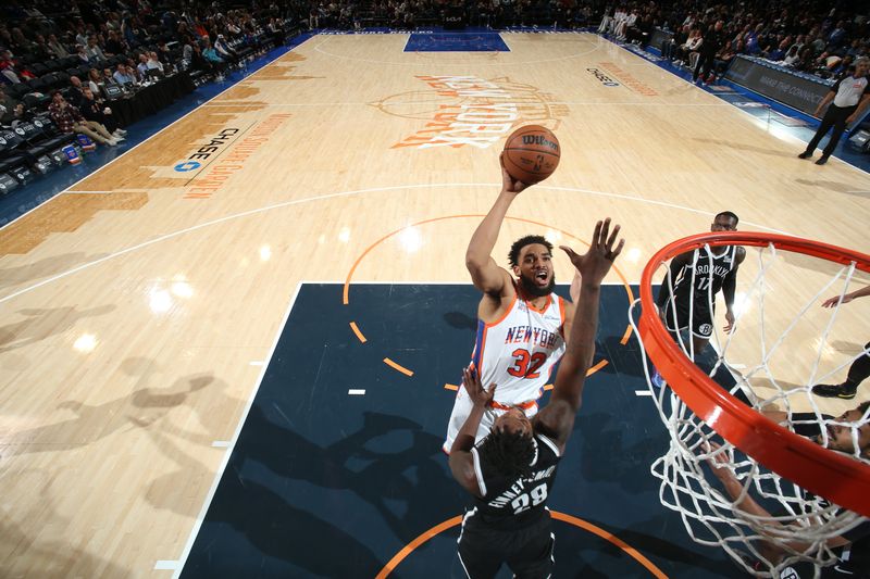 NEW YORK, NY - NOVEMBER 17: Karl-Anthony Towns #32 of the New York Knicks drives to the basket during the game against the Brooklyn Nets on November 17, 2024 at Madison Square Garden in New York City, New York.  NOTE TO USER: User expressly acknowledges and agrees that, by downloading and or using this photograph, User is consenting to the terms and conditions of the Getty Images License Agreement. Mandatory Copyright Notice: Copyright 2024 NBAE  (Photo by Nathaniel S. Butler/NBAE via Getty Images)