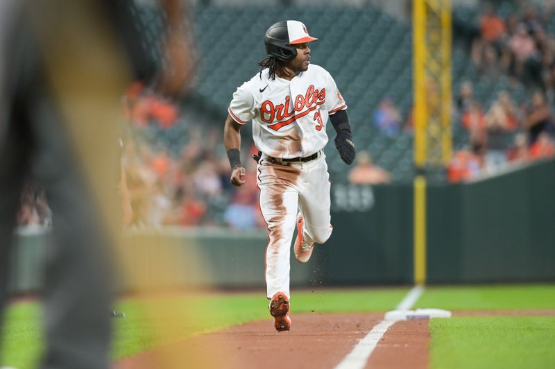 Sep 11, 2023; Baltimore, Maryland, USA;  Baltimore Orioles center fielder Cedric Mullins (31) runs home to score during the second inning against the St. Louis Cardinals at Oriole Park at Camden Yards. Mandatory Credit: Tommy Gilligan-USA TODAY Sports