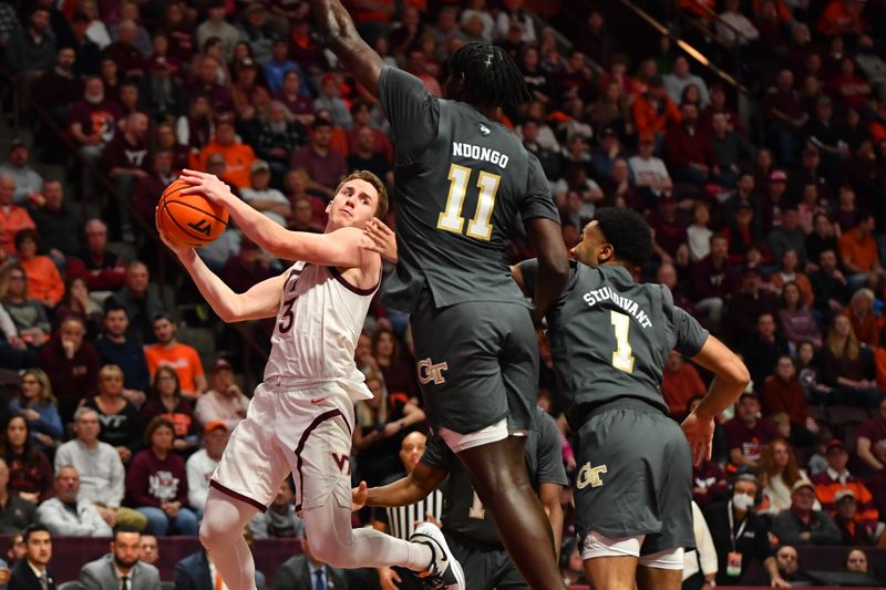 Jan 27, 2024; Blacksburg, Virginia, USA; Virginia Tech Hokies guard Sean Pedulla (3) looks to pass as Georgia Tech Yellow Jackets forward Baye Ndongo (11) and Georgia Tech Yellow Jackets guard Kyle Sturdivant (1) defend his drive into the lane during the second half at Cassell Coliseum. Mandatory Credit: Brian Bishop-USA TODAY Sports