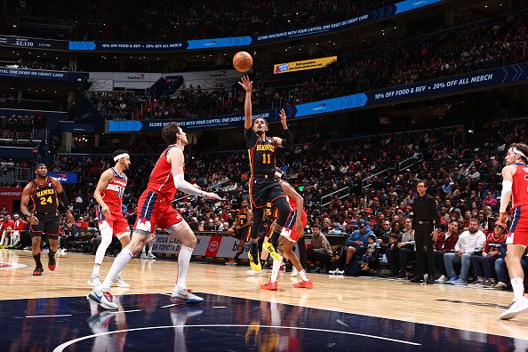 WASHINGTON, DC -? DECEMBER 31: Trae Young #11 of the Atlanta Hawks shoots the ball during the game against the Washington Wizards on December 31, 2023 at Capital One Arena in Washington, DC. NOTE TO USER: User expressly acknowledges and agrees that, by downloading and or using this Photograph, user is consenting to the terms and conditions of the Getty Images License Agreement. Mandatory Copyright Notice: Copyright 2023 NBAE (Photo by Kenny Giarla/NBAE via Getty Images)