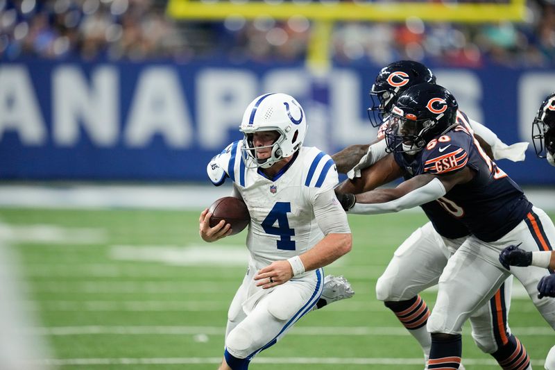 Indianapolis Colts quarterback Sam Ehlinger (4) in action during an NFL preseason football game between the Chicago Bears and the Indianapolis Colts in Indianapolis, Saturday, Aug. 19, 2023. (AP Photo/Darron Cummings)