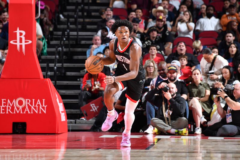 HOUSTON, TX - NOVEMBER 13:  Amen Thompson #1 of the Houston Rockets dribbles the ball during the game against the LA Clippers on November 13, 2024 at the Toyota Center in Houston, Texas. NOTE TO USER: User expressly acknowledges and agrees that, by downloading and or using this photograph, User is consenting to the terms and conditions of the Getty Images License Agreement. Mandatory Copyright Notice: Copyright 2024 NBAE (Photo by Logan Riely/NBAE via Getty Images)