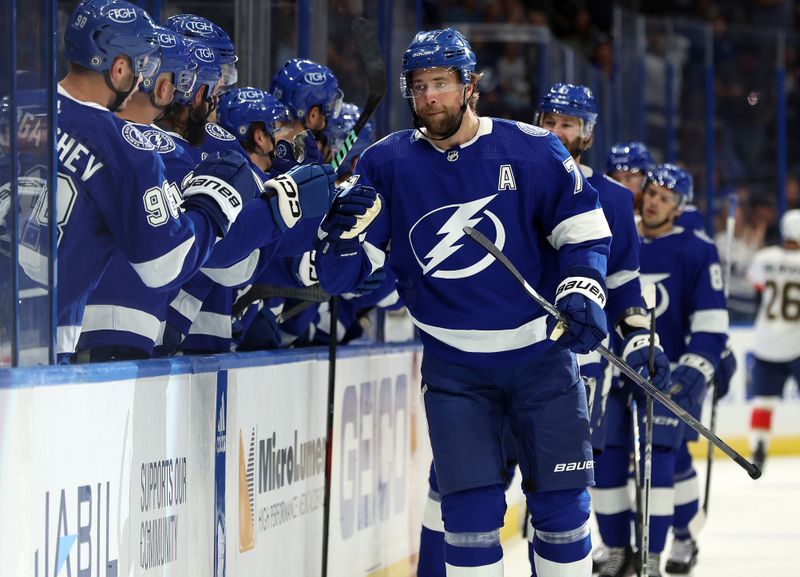 Oct 5, 2023; Tampa, Florida, USA; Tampa Bay Lightning defenseman Victor Hedman (77) is congratulated after he scored a goal against the Florida Panthers during the first period at Amalie Arena. Mandatory Credit: Kim Klement Neitzel-USA TODAY Sports