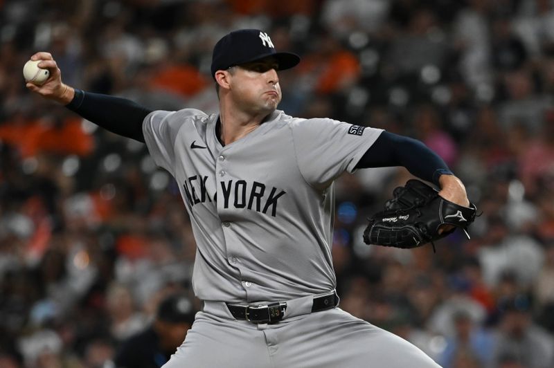 Apr 29, 2024; Baltimore, Maryland, USA; New York Yankees pitcher Clay Holmes (35) throws a ninth inning pitch against the Baltimore Orioles  at Oriole Park at Camden Yards. Mandatory Credit: Tommy Gilligan-USA TODAY Sports