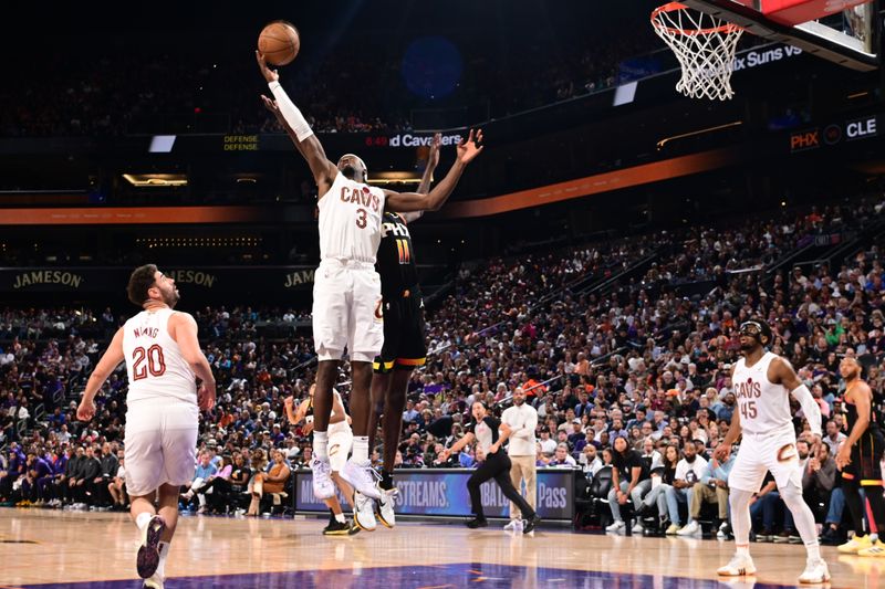 PHOENIX, AZ - APRIL  3: Caris LeVert #3 of the Cleveland Cavaliers rebounds the ball during the game against the Phoenix Suns on April 3, 2024 at Footprint Center in Phoenix, Arizona. NOTE TO USER: User expressly acknowledges and agrees that, by downloading and or using this photograph, user is consenting to the terms and conditions of the Getty Images License Agreement. Mandatory Copyright Notice: Copyright 2024 NBAE (Photo by Kate Frese/NBAE via Getty Images)