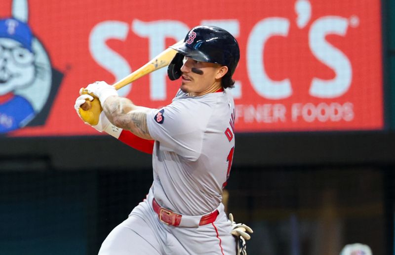 Aug 4, 2024; Arlington, Texas, USA; Boston Red Sox center fielder Jarren Duran (16) hits an rbi double during the third inning against the Texas Rangers at Globe Life Field. Mandatory Credit: Kevin Jairaj-USA TODAY Sports