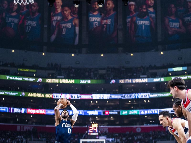 LOS ANGELES, CA - MARCH 1: Paul George #13 of the LA Clippers shoots a free throw during the game against the Washington Wizards on March 1, 2024 at Crypto.Com Arena in Los Angeles, California. NOTE TO USER: User expressly acknowledges and agrees that, by downloading and/or using this Photograph, user is consenting to the terms and conditions of the Getty Images License Agreement. Mandatory Copyright Notice: Copyright 2024 NBAE (Photo by Tyler Ross/NBAE via Getty Images)