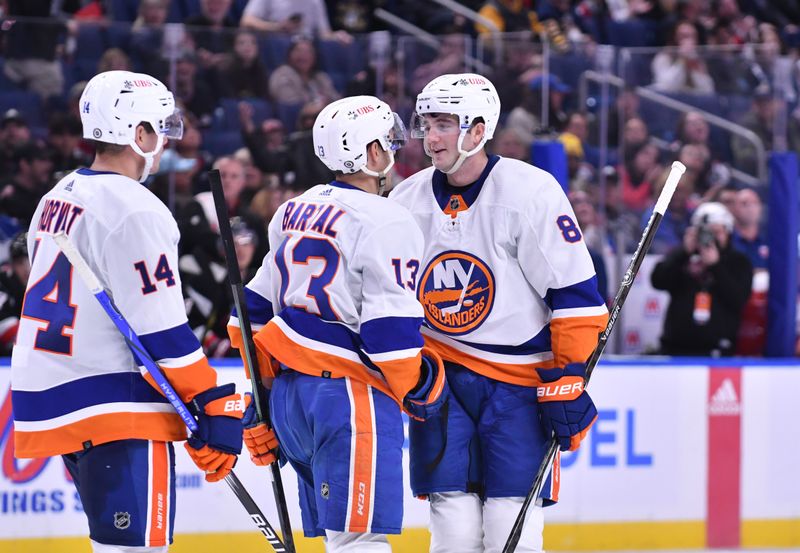 Oct 21, 2023; Buffalo, New York, USA; New York Islanders defenseman Noah Dobson (8) is congratulated by center Mathew Barzal (13) and center Bo Horvat (14) after scoring a goal against the Buffalo Sabres in the third period at KeyBank Center. Mandatory Credit: Mark Konezny-USA TODAY Sports