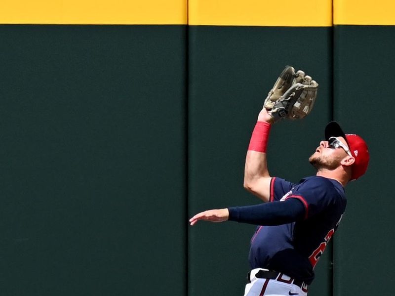 Mar 3, 2024; North Port, Florida, USA; Atlanta Braves left fielder Jarred Kelenic (24)catches a fly ball in the first inning of the spring training game against the Philadelphia Phillies  at CoolToday Park. Mandatory Credit: Jonathan Dyer-USA TODAY Sports