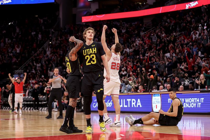 HOUSTON, TEXAS - JANUARY 20: Lauri Markkanen #23 of the Utah Jazz consoles Jordan Clarkson #00 after missing the final shot in overtime as Alperen Sengun #28 of the Houston Rockets celebrates at Toyota Center on January 20, 2024 in Houston, Texas.  NOTE TO USER: User expressly acknowledges and agrees that, by downloading and or using this photograph, User is consenting to the terms and conditions of the Getty Images License Agreement. (Photo by Tim Warner/Getty Images)