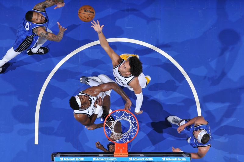 ORLANDO, FL - MARCH 13: Jalen Wilson #22 of the Brooklyn Nets rebounds the ball during the game against the Orlando Magic on March 13, 2024 at the Kia Center in Orlando, Florida. NOTE TO USER: User expressly acknowledges and agrees that, by downloading and or using this photograph, User is consenting to the terms and conditions of the Getty Images License Agreement. Mandatory Copyright Notice: Copyright 2024 NBAE (Photo by Fernando Medina/NBAE via Getty Images)