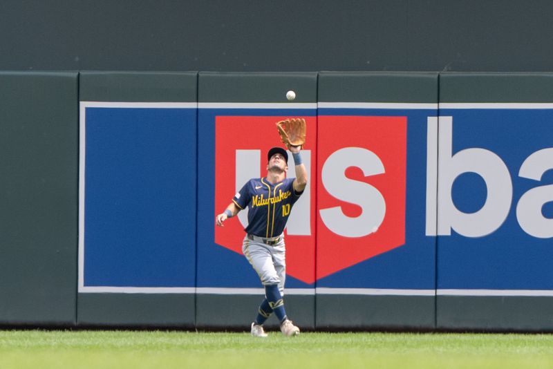 Jul 21, 2024; Minneapolis, Minnesota, USA; Minnesota Twins center field Byron Buxton (25) flies out to Milwaukee Brewers outfielder Sal Frelick (10) in the fifth inning at Target Field. Mandatory Credit: Matt Blewett-USA TODAY Sports