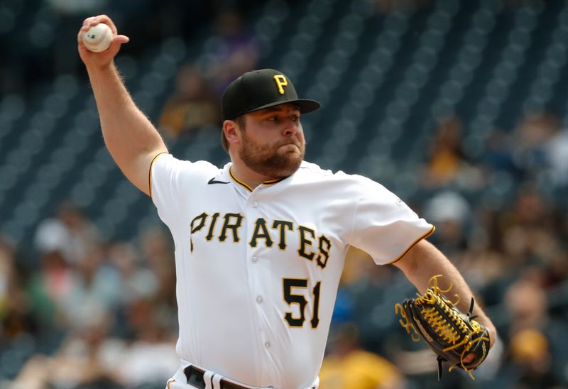 May 10, 2023; Pittsburgh, Pennsylvania, USA;  Pittsburgh Pirates relief pitcher David Bednar (51) pitches against the Colorado Rockies during the ninth inning at PNC Park. Colorado won 4-3. Mandatory Credit: Charles LeClaire-USA TODAY Sports