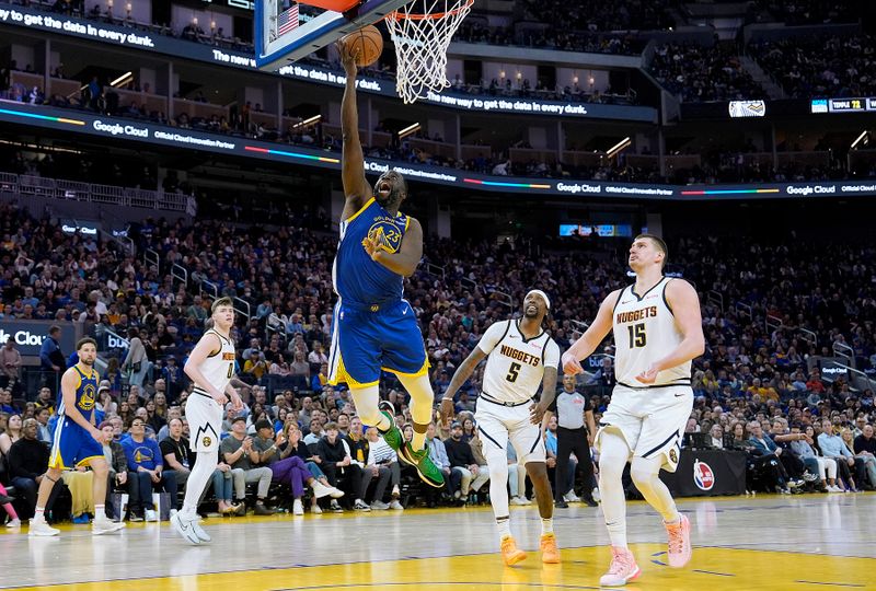 SAN FRANCISCO, CALIFORNIA - FEBRUARY 25: Draymond Green #23 of the Golden State Warriors goes in for a layup against the Denver Nuggets in the fourth quarter at Chase Center on February 25, 2024 in San Francisco, California. NOTE TO USER: User expressly acknowledges and agrees that, by downloading and or using this photograph, User is consenting to the terms and conditions of the Getty Images License Agreement. (Photo by Thearon W. Henderson/Getty Images)