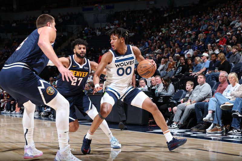 MINNEAPOLIS, MN -  OCTOBER 17: Terrence Shannon Jr. #00 of the Minnesota Timberwolves dribbles the ball during the game against the Denver Nuggets during the 2024 NBA Preseason on October 17, 2024 at Target Center in Minneapolis, Minnesota. NOTE TO USER: User expressly acknowledges and agrees that, by downloading and or using this Photograph, user is consenting to the terms and conditions of the Getty Images License Agreement. Mandatory Copyright Notice: Copyright 2024 NBAE (Photo by David Sherman/NBAE via Getty Images)