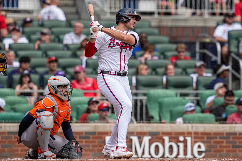 Sep 14, 2025; Cumberland, Georgia, USA; Atlanta Braves first baseman Matt Olson (28) hits a single against the Houston Astros during the third inning at Truist Park. Mandatory Credit: Dale Zanine-Imagn Images