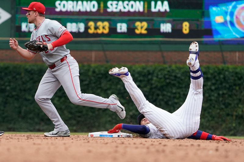 Jul 7, 2024; Chicago, Illinois, USA; Los Angeles Angels second base Brandon Drury (23) tags out Chicago Cubs catcher Miguel Amaya (9) out at second baseman during the third inning at Wrigley Field. Mandatory Credit: David Banks-USA TODAY Sports