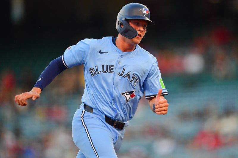 Aug 12, 2024; Anaheim, California, USA; Toronto Blue Jays second baseman Will Wagner (7) runs to third against the Los Angeles Angels during the second inning at Angel Stadium. Mandatory Credit: Gary A. Vasquez-USA TODAY Sports