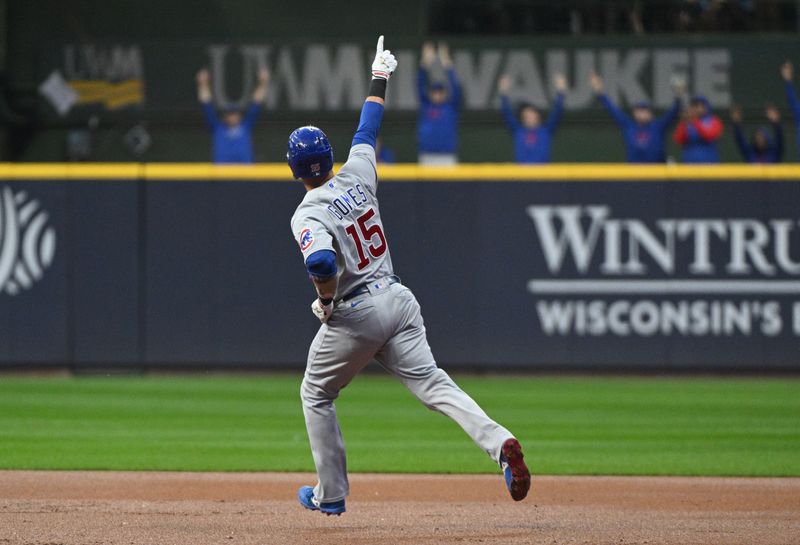 Sep 30, 2023; Milwaukee, Wisconsin, USA; Chicago Cubs catcher Yan Gomes (15) celebrates with the Chicago Cubs bullpen as he rounds the bases after hitting a home run against the Milwaukee Brewers in the first inning at American Family Field. Mandatory Credit: Michael McLoone-USA TODAY Sports