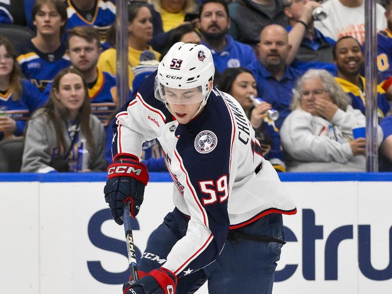 Oct 1, 2024; St. Louis, Missouri, USA;  Columbus Blue Jackets right wing Yegor Chinakhov (59) controls the puck against the St. Louis Blues during the first period at Enterprise Center. Mandatory Credit: Jeff Curry-Imagn Images