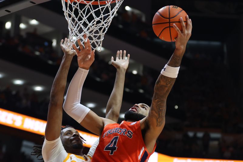 Feb 28, 2024; Knoxville, Tennessee, USA; Auburn Tigers forward Johni Broome (4) goes to the basket against the Tennessee Volunteers during the first half at Thompson-Boling Arena at Food City Center. Mandatory Credit: Randy Sartin-USA TODAY Sports