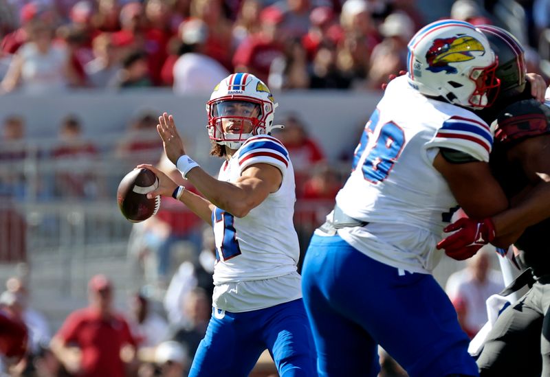 Oct 15, 2022; Norman, Oklahoma, USA;  Kansas Jayhawks quarterback Jason Bean (17) throws during the first half against the Oklahoma Sooners at Gaylord Family-Oklahoma Memorial Stadium. Mandatory Credit: Kevin Jairaj-USA TODAY Sports