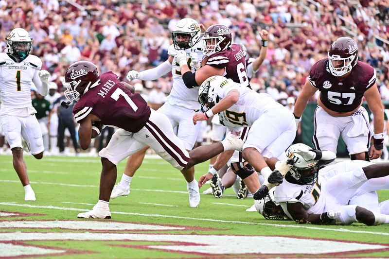 Sep 2, 2023; Starkville, Mississippi, USA; Mississippi State Bulldogs running back Jo'Quavious Marks (7) scores a touchdown against the Southeastern Louisiana Lions during the fourth quarter at Davis Wade Stadium at Scott Field. Mandatory Credit: Matt Bush-USA TODAY Sports