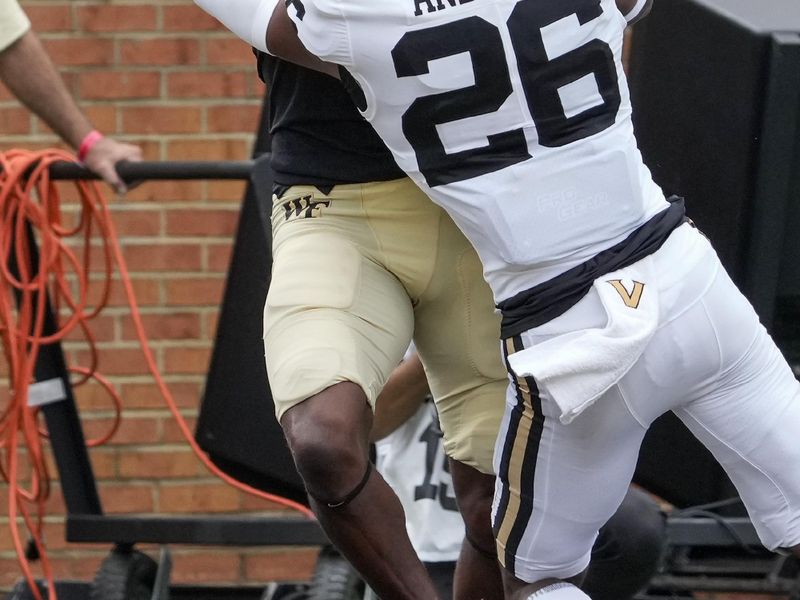 Sep 9, 2023; Winston-Salem, North Carolina, USA; Wake Forest Demon Deacons wide receiver Jahmal Banks (80) is defended by Vanderbilt Commodores cornerback BJ Anderson (26) trying for a catch during the second quarter at Allegacy Federal Credit Union Stadium. Mandatory Credit: Jim Dedmon-USA TODAY Sports