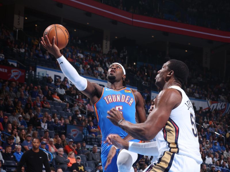 OKLAHOMA CITY, OK - NOVEMBER 13: Luguentz Dort #5 of the Oklahoma City Thunder drives to the basket during the game against the New Orleans Pelicans on November 13, 2024 at Paycom Center in Oklahoma City, Oklahoma. NOTE TO USER: User expressly acknowledges and agrees that, by downloading and or using this photograph, User is consenting to the terms and conditions of the Getty Images License Agreement. Mandatory Copyright Notice: Copyright 2024 NBAE (Photo by Nathaniel S. Butler/NBAE via Getty Images)