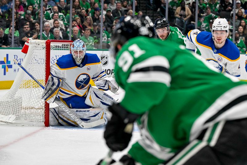 Apr 9, 2024; Dallas, Texas, USA; Buffalo Sabres goaltender Ukko-Pekka Luukkonen (1) faces a shot by Dallas Stars center Tyler Seguin (91) during the second period at the American Airlines Center. Mandatory Credit: Jerome Miron-USA TODAY Sports