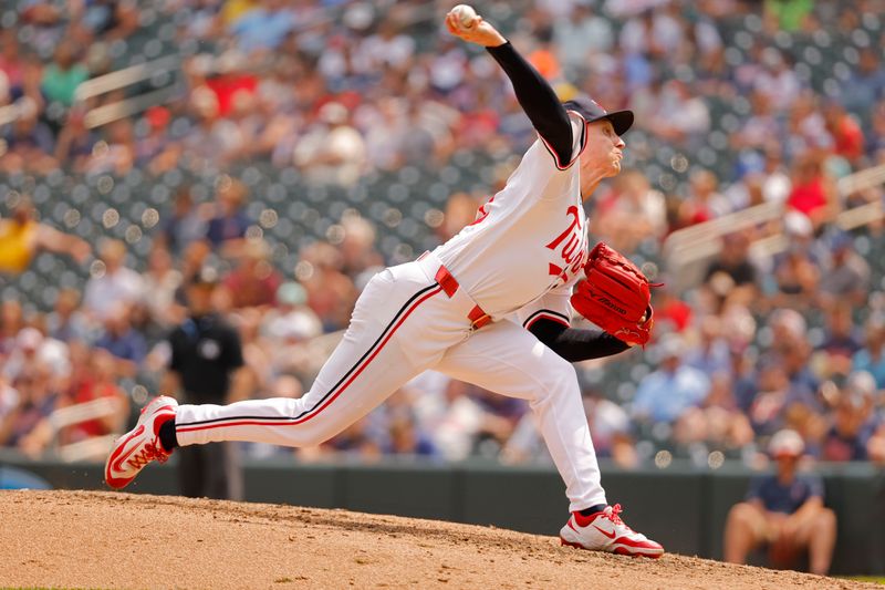 Jul 30, 2025; Minneapolis, Minnesota, USA; Minnesota Twins relief pitcher Griffin Jax (22) throws to the Boston Red Sox in the ninth inning at Target Field. Mandatory Credit: Bruce Kluckhohn-Imagn Images