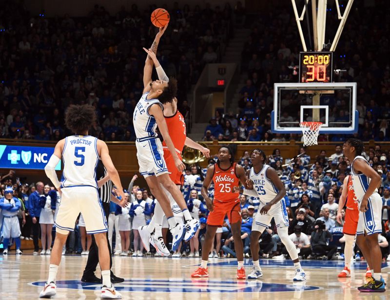 Feb 25, 2023; Durham, North Carolina, USA; Duke Blue Devils center Dereck Lively (1) wins the opening tip during the first half against the Virginia Tech Hokies at Cameron Indoor Stadium. Mandatory Credit: Rob Kinnan-USA TODAY Sports