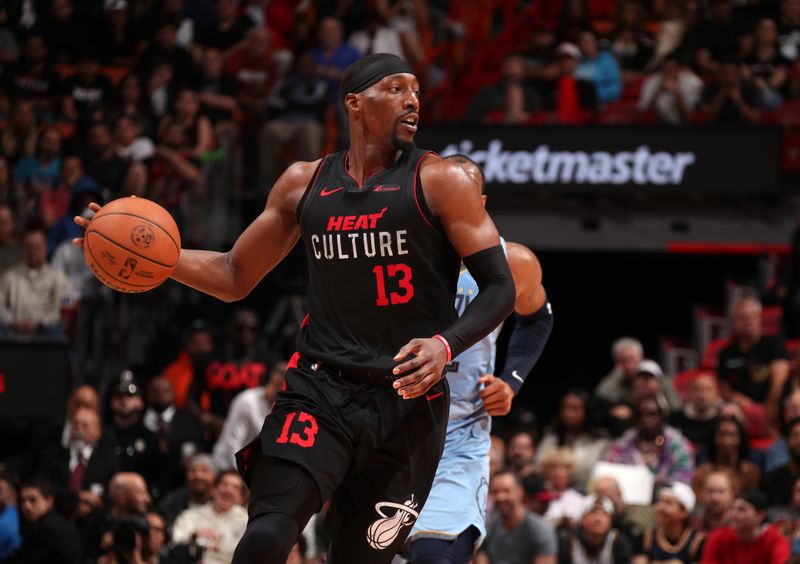 MIAMI, FL - JANUARY 24:  Bam Adebayo #13 of the Miami Heat handles the ball during the game against the Memphis Grizzlies on January 24, 2024 at Kaseya Center in Miami, Florida. NOTE TO USER: User expressly acknowledges and agrees that, by downloading and or using this Photograph, user is consenting to the terms and conditions of the Getty Images License Agreement. Mandatory Copyright Notice: Copyright 2024 NBAE (Photo by Issac Baldizon/NBAE via Getty Images)