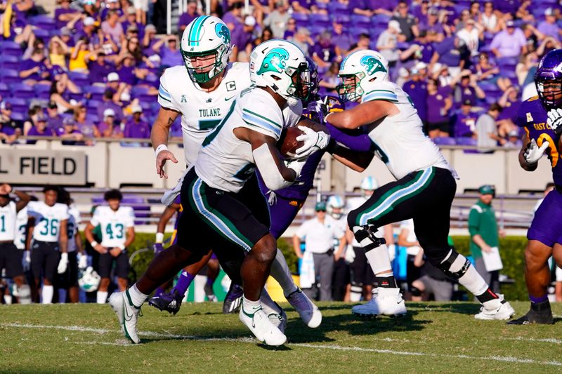 Oct 2, 2021; Greenville, North Carolina, USA;  Tulane Green Wave running back Cameron Carroll (20) carries the ball against the East Carolina Pirates during the second half at Dowdy-Ficklen Stadium. Mandatory Credit: James Guillory-USA TODAY Sports