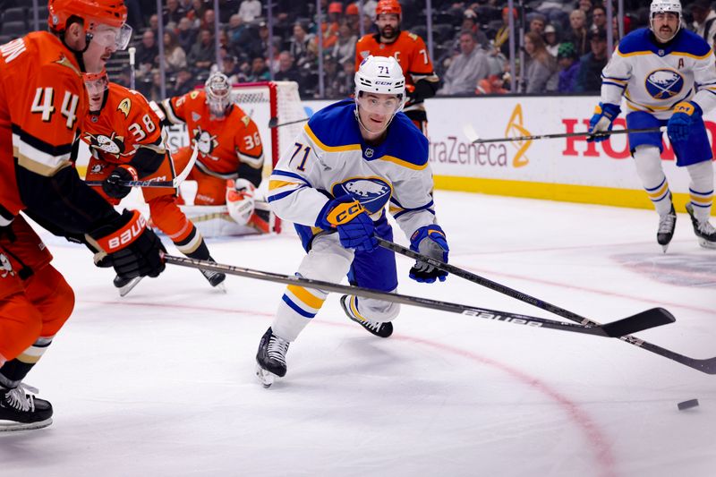 Nov 22, 2024; Anaheim, California, USA; Buffalo Sabres center Ryan McLeod (71) vies for the puck against Anaheim Ducks left wing Ross Johnston (44) during the first period at Honda Center. Mandatory Credit: Ryan Sun-Imagn Images