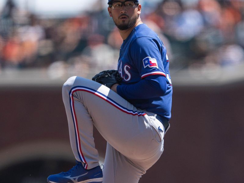 Aug 13, 2023; San Francisco, California, USA; Texas Rangers starting pitcher Dane Dunning (33) pitches during the first inning against the San Francisco Giants at Oracle Park. Mandatory Credit: Stan Szeto-USA TODAY Sports