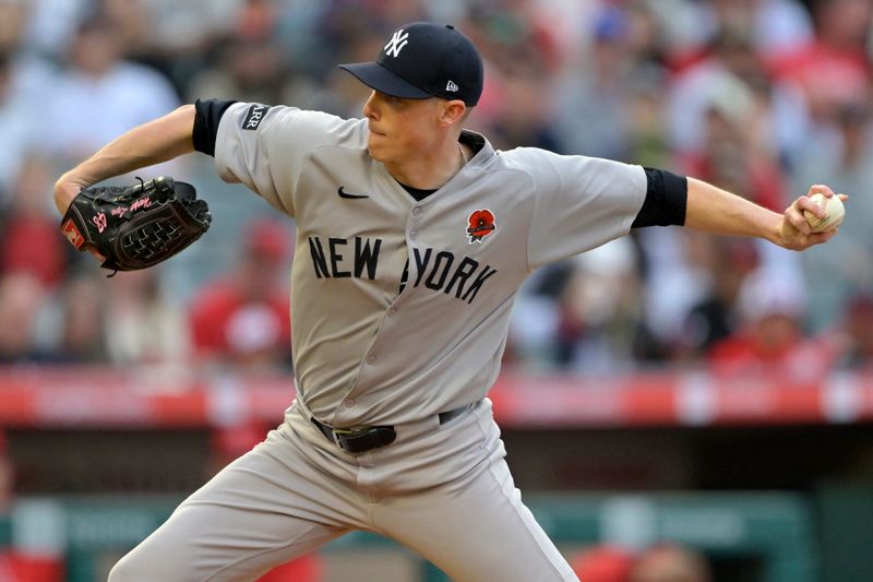 May 26, 2025; Anaheim, California, USA;  New York Yankees starting pitcher Ryan Yarbrough (33) delivers to the plate in the first inning against the Los Angeles Angels at Angel Stadium. Mandatory Credit: Jayne Kamin-Oncea-Imagn Images