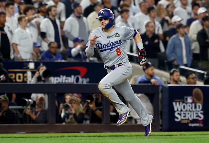 Oct 30, 2024; New York, New York, USA; Los Angeles Dodgers third baseman Enrique Hernandez (8) scores during the eighth inning against the New York Yankees in game five of the 2024 MLB World Series at Yankee Stadium. Mandatory Credit: Vincent Carchietta-Imagn Images