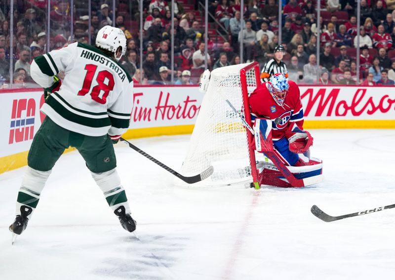 Jan 20, 2026; Montreal, Quebec, CAN; Montreal Canadiens goalie Jakub Dobes (75) stops Minnesota Wild forward Vincent Hinostroza (18) during the first period at the Bell Centre. Mandatory Credit: Eric Bolte-Imagn Images