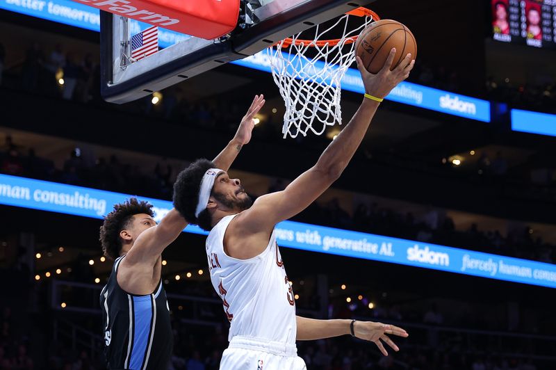 ATLANTA, GEORGIA - MARCH 06:  Jarrett Allen #31 of the Cleveland Cavaliers drives against Jalen Johnson #1 of the Atlanta Hawks during the first quarter at State Farm Arena on March 06, 2024 in Atlanta, Georgia.  NOTE TO USER: User expressly acknowledges and agrees that, by downloading and/or using this photograph, user is consenting to the terms and conditions of the Getty Images License Agreement.  (Photo by Kevin C. Cox/Getty Images)