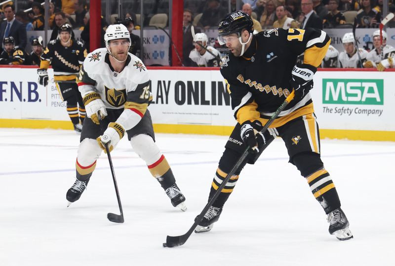 Mar 11, 2025; Pittsburgh, Pennsylvania, USA;  Pittsburgh Penguins right wing Bryan Rust (17) handles the puck against Vegas Golden Knights defenseman Noah Hanifin (15) /in overtime at PPG Paints Arena. Mandatory Credit: Charles LeClaire-Imagn Images