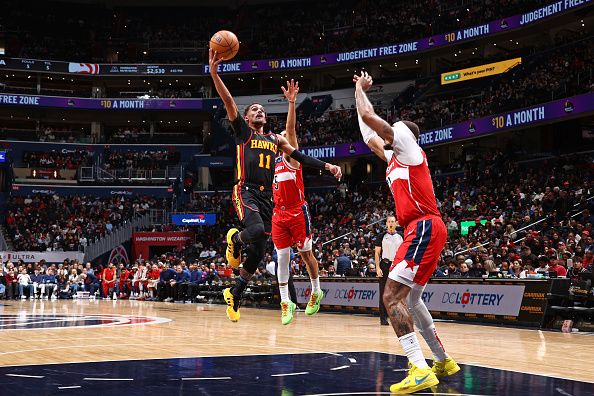 WASHINGTON, DC -? DECEMBER 31: Trae Young #11 of the Atlanta Hawks shoots the ball during the game against the Washington Wizards on December 31, 2023 at Capital One Arena in Washington, DC. NOTE TO USER: User expressly acknowledges and agrees that, by downloading and or using this Photograph, user is consenting to the terms and conditions of the Getty Images License Agreement. Mandatory Copyright Notice: Copyright 2023 NBAE (Photo by Kenny Giarla/NBAE via Getty Images)