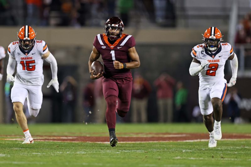 Oct 26, 2023; Blacksburg, Virginia, USA; Virginia Tech Hokies quarterback Kyron Drones (1) runs with the ball against Syracuse Orange linebacker Derek McDonald (15) and linebacker Marlowe Wax (2) during the second quarter at Lane Stadium. Mandatory Credit: Peter Casey-USA TODAY Sports