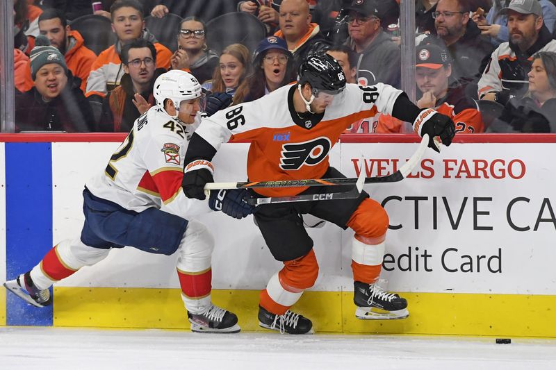 Dec 5, 2024; Philadelphia, Pennsylvania, USA; Philadelphia Flyers left wing Joel Farabee (86) controls against Florida Panthers defenseman Gustav Forsling (42) during the first period at Wells Fargo Center. Mandatory Credit: Eric Hartline-Imagn Images