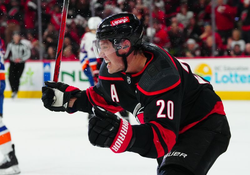 Apr 22, 2024; Raleigh, North Carolina, USA; Carolina Hurricanes center Sebastian Aho (20) celebrates his goal against the New York Islanders during the third period in game two of the first round of the 2024 Stanley Cup Playoffs at PNC Arena. Mandatory Credit: James Guillory-USA TODAY Sports